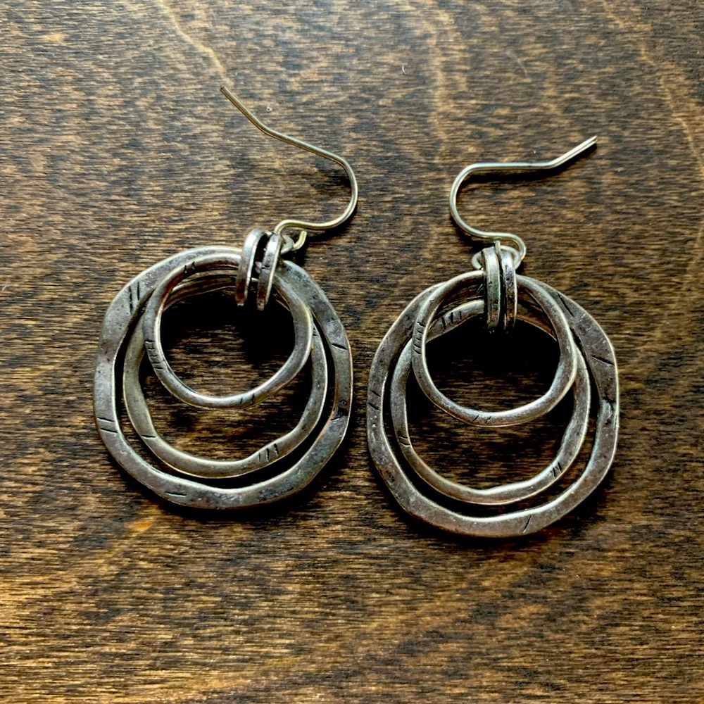 Silver dangle earrings.